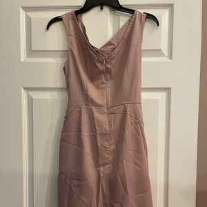 Mauve fitted dress hits just above the knee.